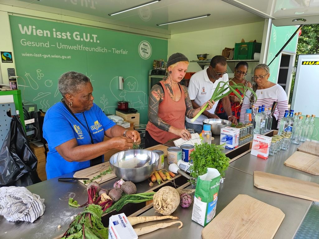 AgriSkills participants preparing vegetables together during a practical cooking workshop in Vienna.
