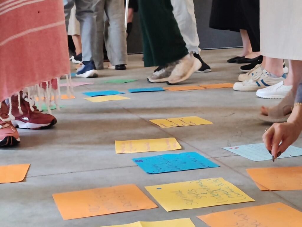 Participants exchanging ideas during a creative group exercise