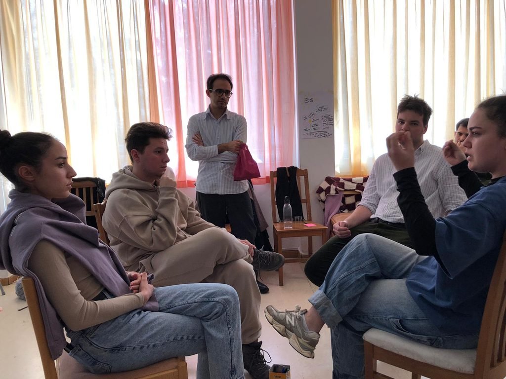 Participants exchanging ideas during a small-group discussion