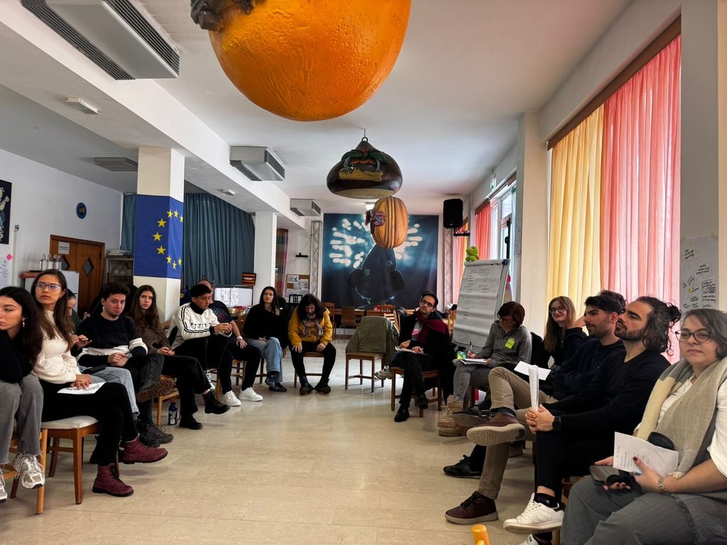 Future Builders participants taking part in a full-group learning session in Rimini”